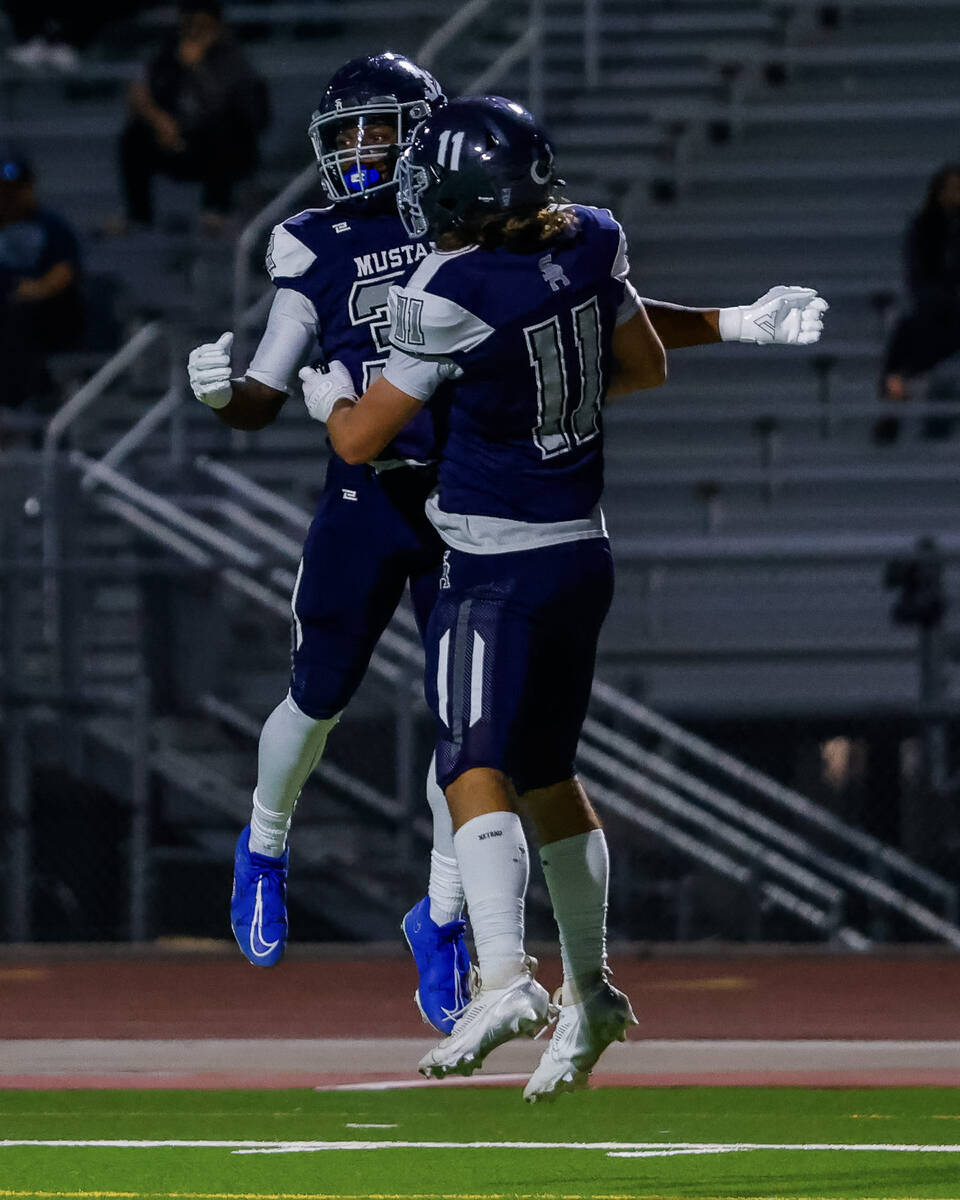 Shadow Ridge Running Back Tyrell Craven (32) celebrates with Joseph Darr (11) after scoring a t ...