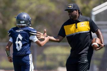 Clark head coach Deumaine Reeder goes in for a handshake with Cheyenne quarterback Kaleigha Ple ...