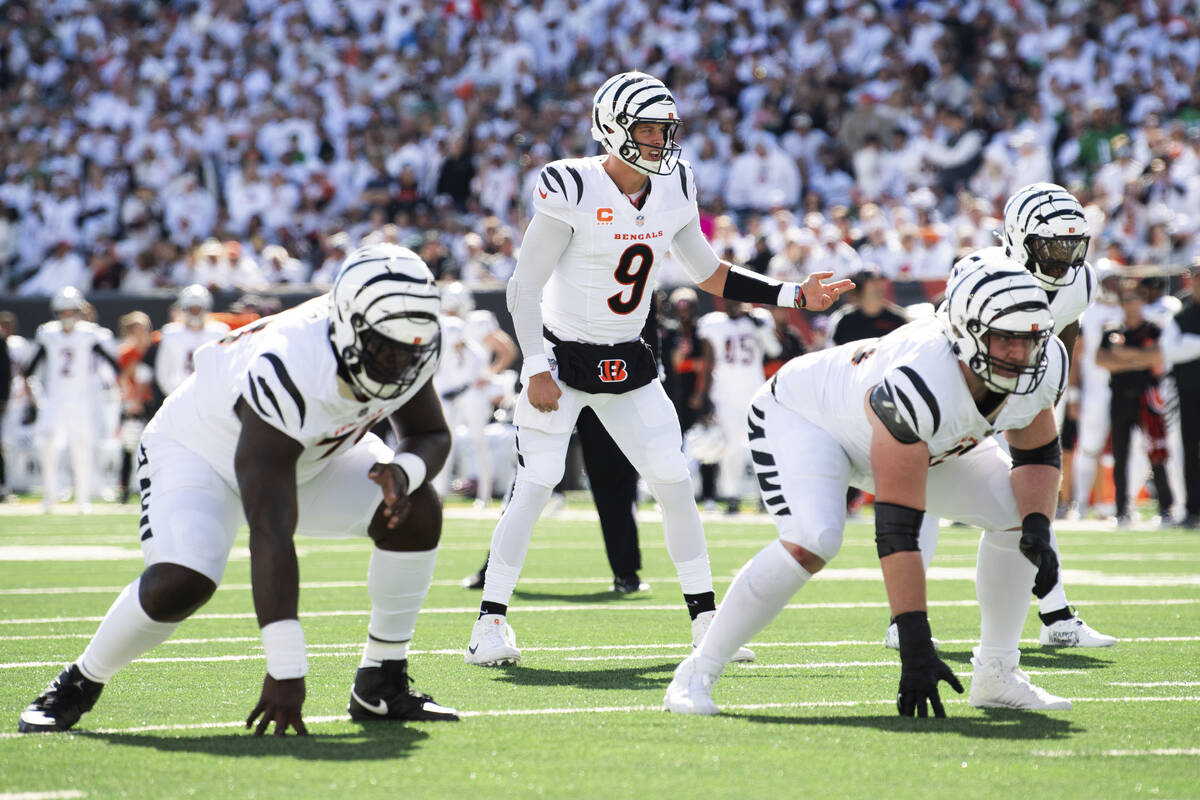 Cincinnati Bengals quarterback Joe Burrow (9) calls a play during an NFL football game against ...