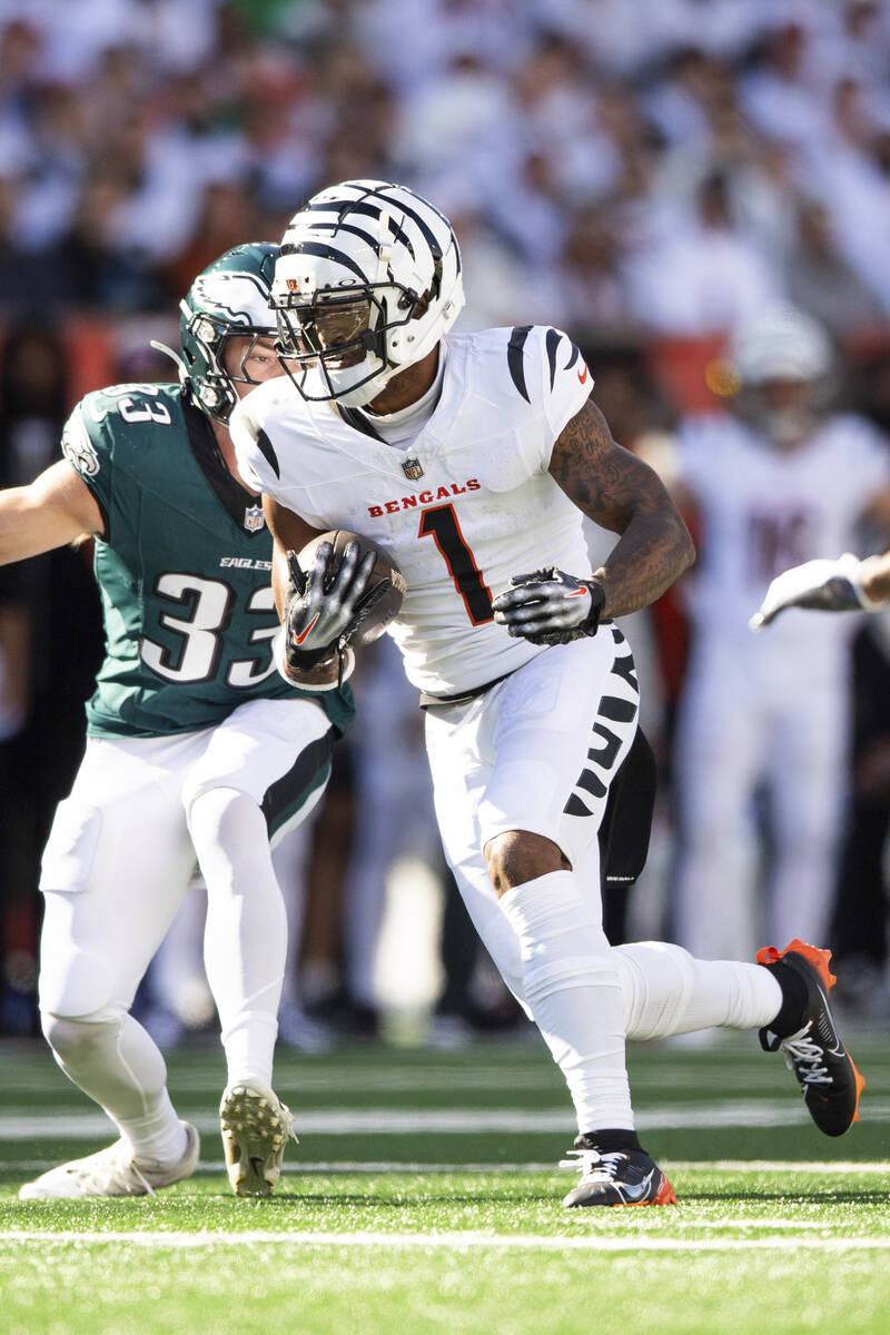 Cincinnati Bengals wide receiver Ja'Marr Chase (1) carries the ball during an NFL football game ...