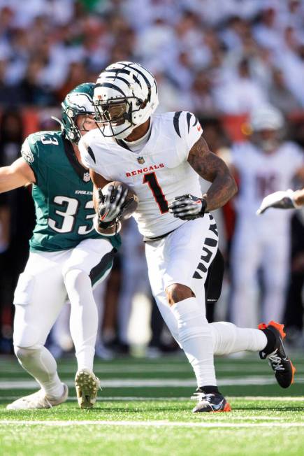 Cincinnati Bengals wide receiver Ja'Marr Chase (1) carries the ball during an NFL football game ...