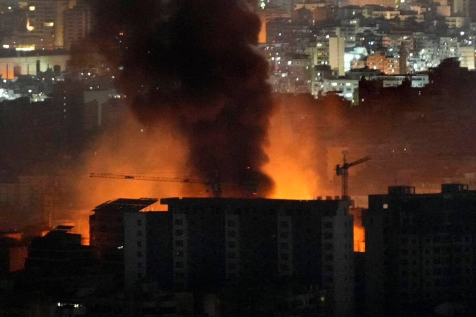 Flame and smoke rises from Israeli airstrikes on Dahiyeh, in the southern suburb of Beirut, Leb ...