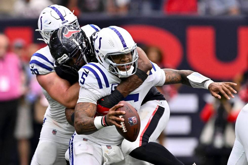 Houston Texans defensive end Danielle Hunter (55) sacks Indianapolis Colts quarterback Anthony ...