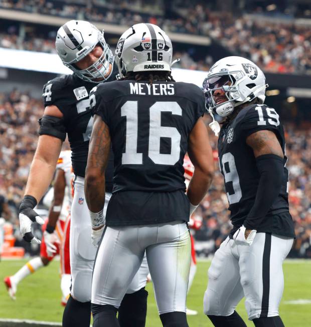 Raiders wide receiver Jakobi Meyers (16) celebrates his touchdown with offensive tackle Kolton ...