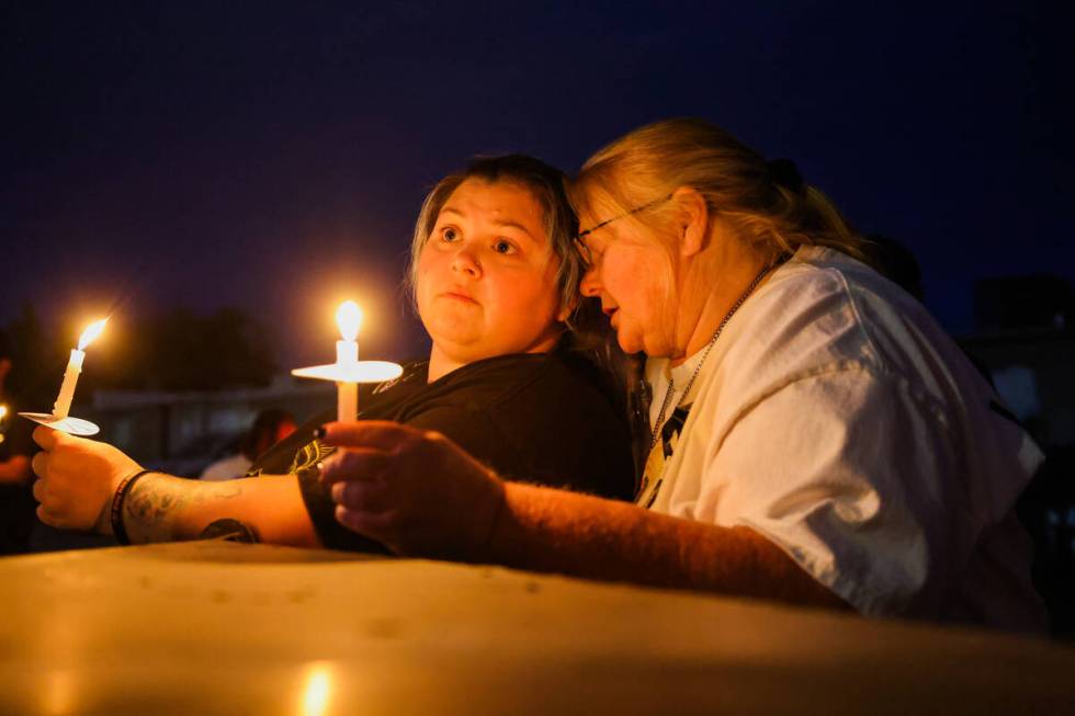 Lori Judd, right, stands with her daughter, Ashley Anderson, during a vigil for 17-year-old Jo ...