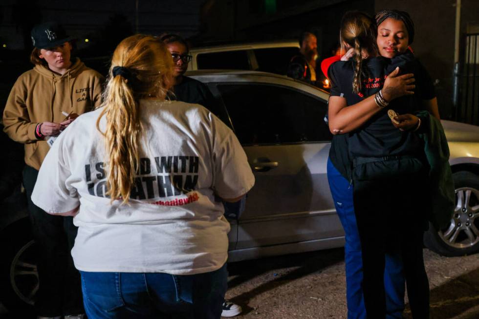 Mellisa Ready, right, hugs Neysha Velasquez, facing, during a vigil for Ready’s son, 17-year- ...