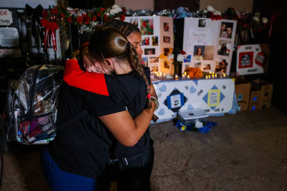 Mellisa Ready, right, hugs Neysha Velasquez during a vigil for Ready’s son, 17-year-old Jonat ...