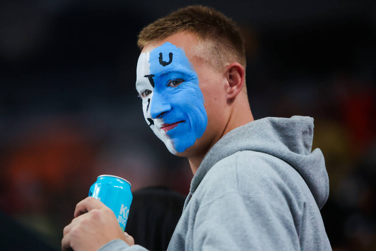 A Utah Hockey Club fan watches his team warm up during an NHL hockey game between the Golden Kn ...