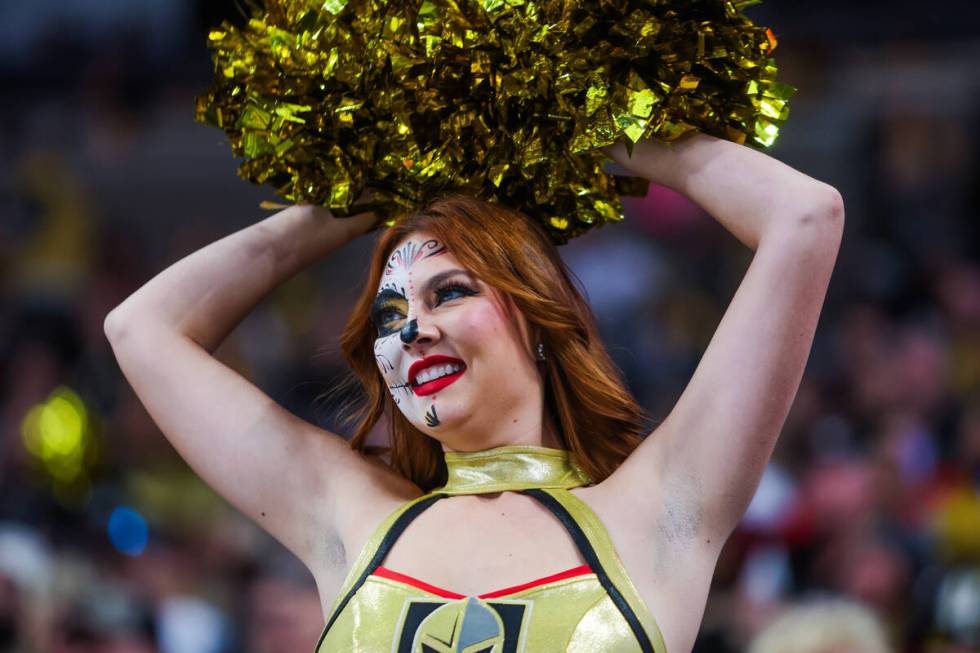 A member of the Golden Knights’ Vegas Vivas cheers during an NHL hockey game between the ...