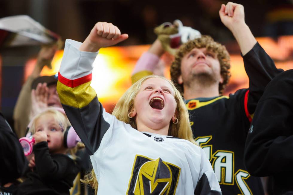 Golden Knights fans cheer after a goal during an NHL hockey game between the Golden Knights and ...