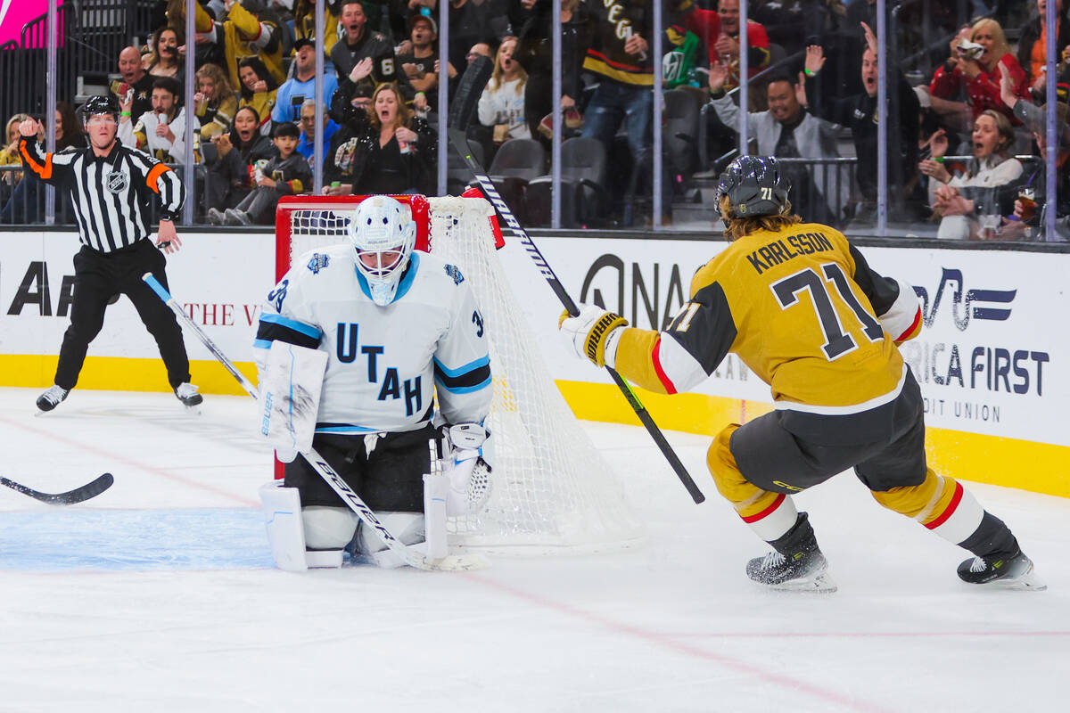 Golden Knights center William Karlsson (71) celebrates a goal as Utah Hockey Club goaltender Co ...