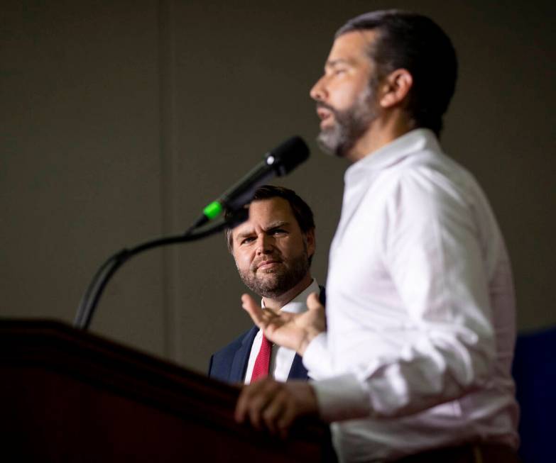 Republican vice presidential nominee Sen. JD Vance, R-Ohio, left, watches Donald Trump Jr., rig ...