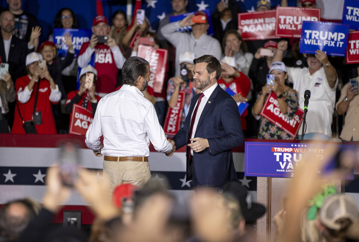 Republican vice presidential nominee Sen. JD Vance, R-Ohio, right, welcomes Donald Trump Jr., l ...