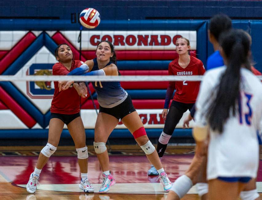 Coronado's Isabelle Guerzon (5) and Reagan Vint (11) work together for a return back to Bishop ...