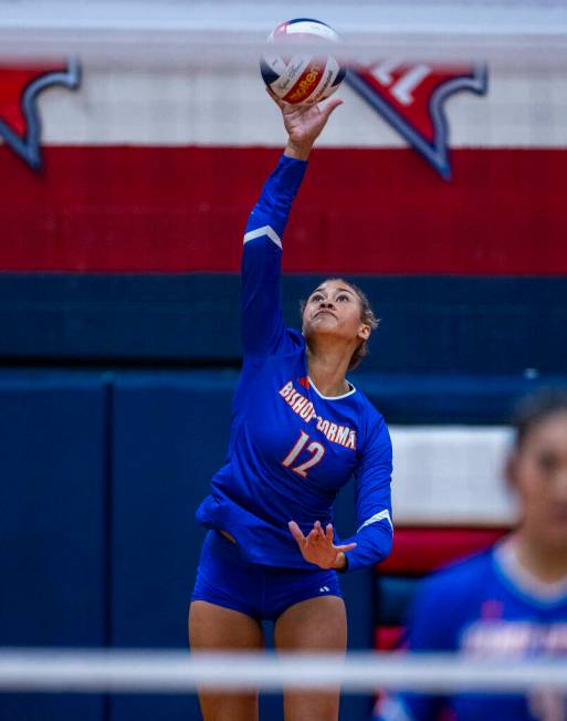 Bishop Gorman's Brooklynn Williams (12) serves to Coronado during the first set of their Class ...