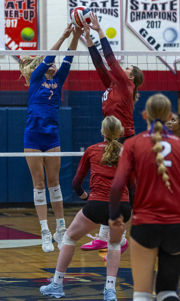 Bishop Gorman's Ellie Prindl (7) and Coronado's Rachel Schwartz (10) battle for the shot above ...