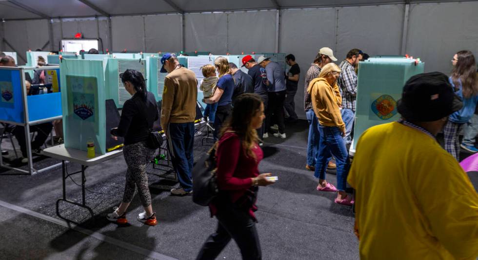 Voters cast their ballots on the final day of early voting in the polling location at the Thund ...