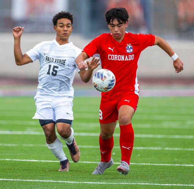 Coronado midfielder Cy Adams (8) advances the ball pursued by Palo Verde forward Trevon Aytch ( ...