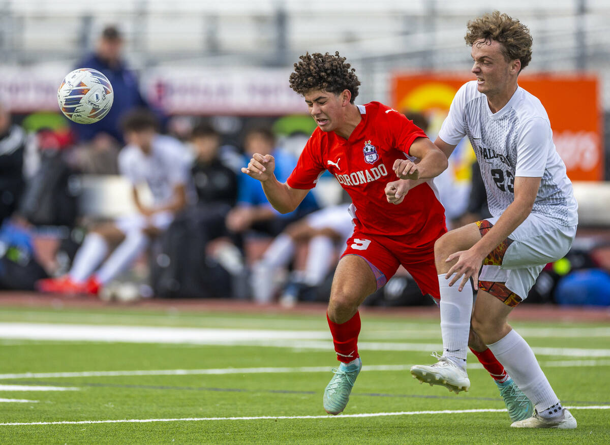 Coronado striker Dylan Flores (9) heads the ball away from Palo Verde defender Ben Legrand (23) ...