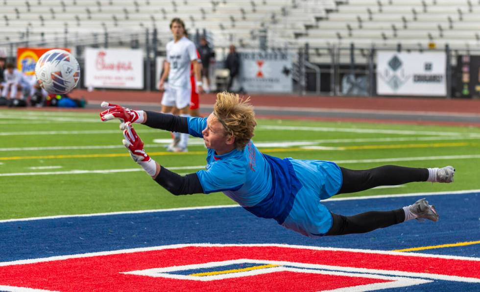 Palo Verde goalkeeper Landon Blanchard (1) makes a diving save against Coronado during the firs ...