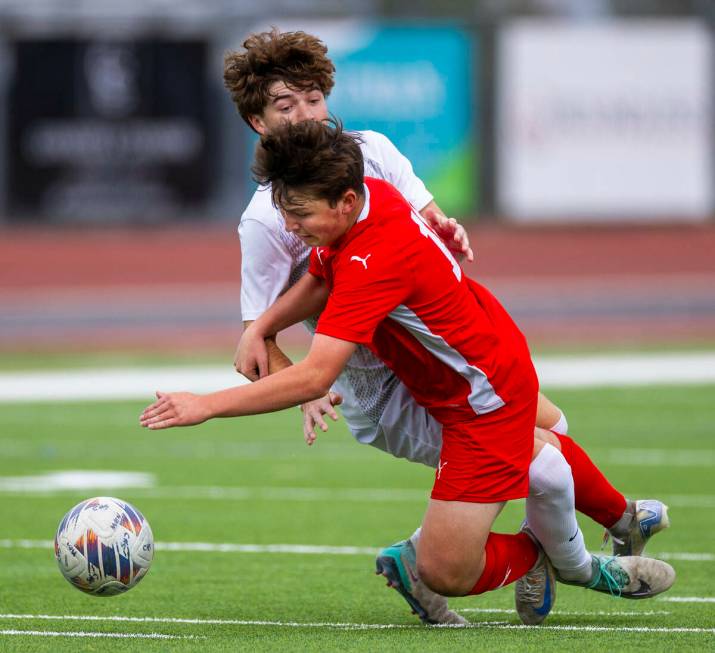 Coronado midfielder Aiden Sena (10) is tackled by Palo Verde defender Jaxon Law (2) during the ...