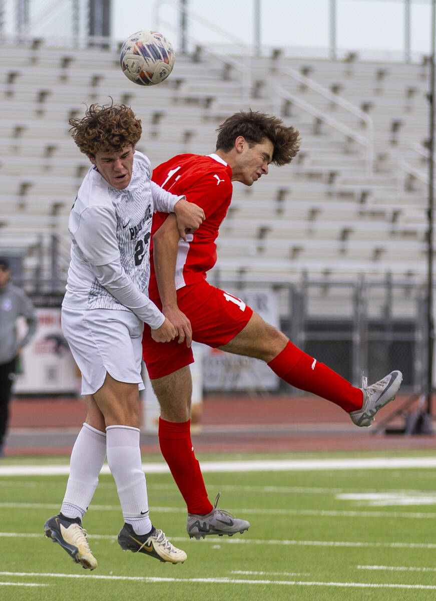 Palo Verde midfielder Trustin Parker (22) and Coronado striker Gavin Flickinger (11) collide wh ...