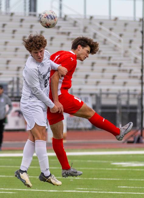 Palo Verde midfielder Trustin Parker (22) and Coronado striker Gavin Flickinger (11) collide wh ...