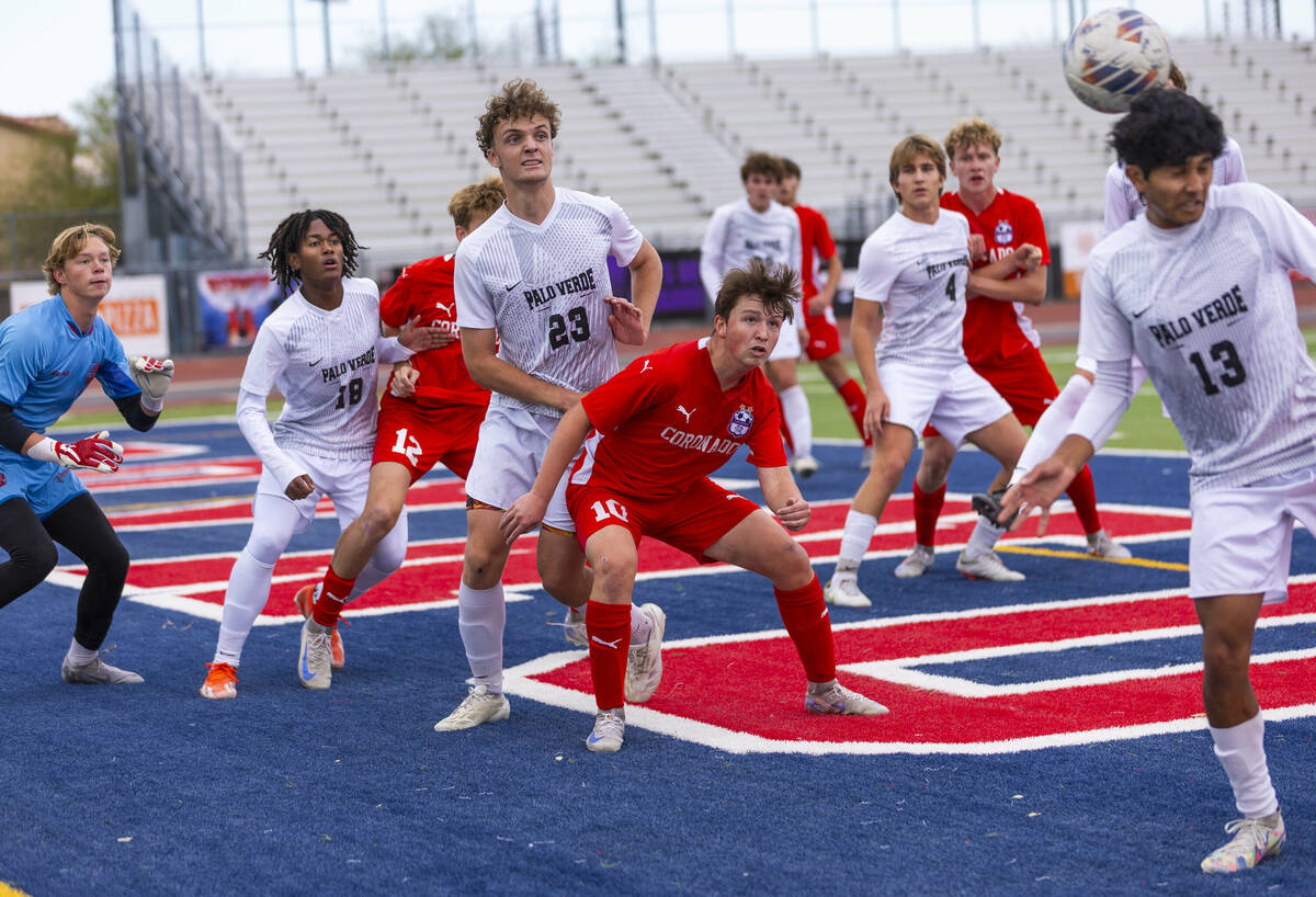 Palo Verde wing back Haydn Rodrigues (13) looks to head the ball on a corner kick as teammates ...