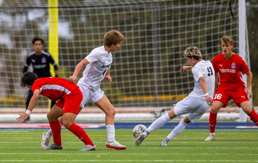 Palo Verde forward Noah Johnson (11) takes a shot at the net as Coronado goalkeeper Logan Pierc ...