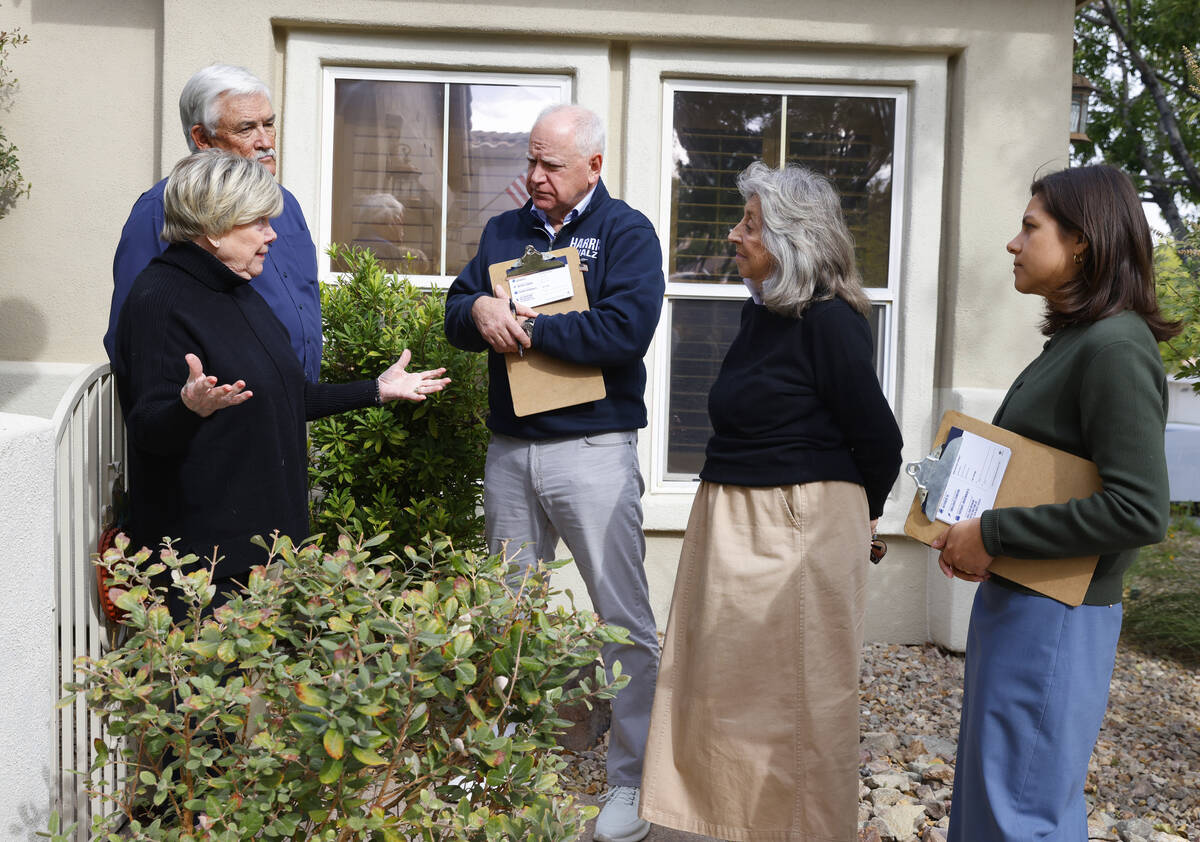 Democratic vice presidential nominee Tim Walz, center, and Rep. Dina Titus, D-Nev., second righ ...