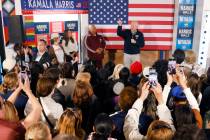 Democratic vice presidential nominee Tim Walz speaks to rally campaign volunteers during a canv ...