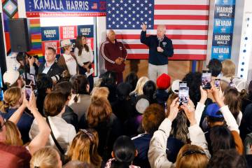 Democratic vice presidential nominee Tim Walz speaks to rally campaign volunteers during a canv ...