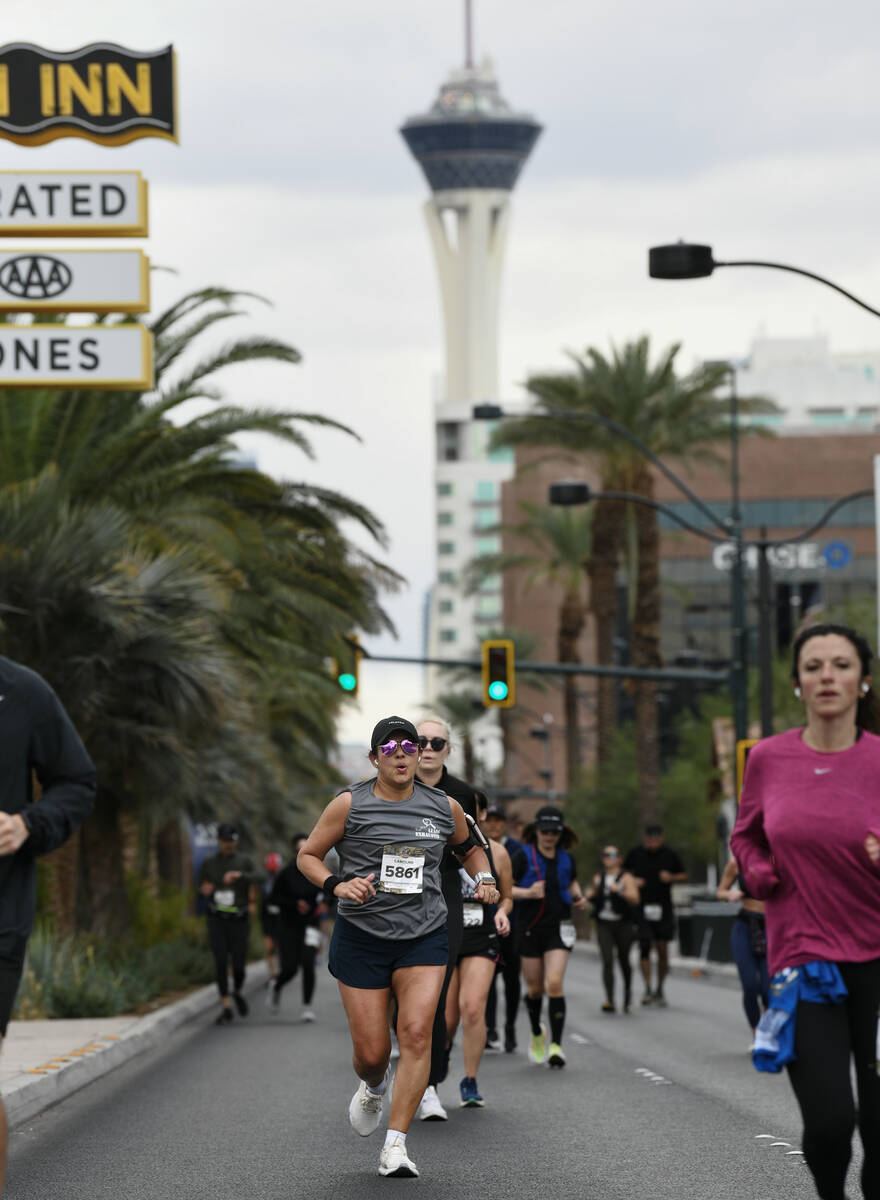 Runners head north on Las Vegas Boulevard during the Las Vegas Marathon Sunday, Nov. 3, 2024, i ...