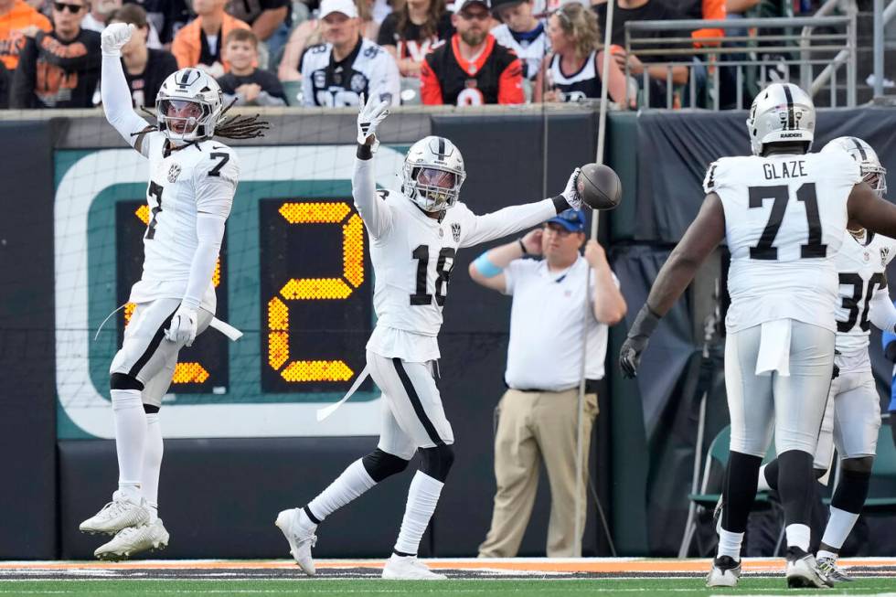 Las Vegas Raiders cornerback Jack Jones (18) celebrates after returning an interception for a t ...