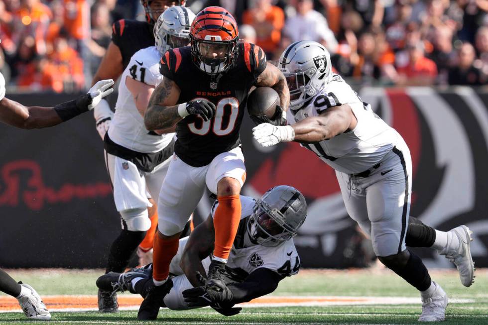 Cincinnati Bengals running back Chase Brown (30) runs against Las Vegas Raiders linebacker Robe ...