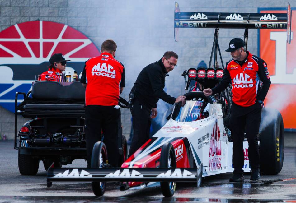 NHRA Top Fuel driver Doug Kalitta gets ready to race during the NHRA Top Fuel semifinals at the ...