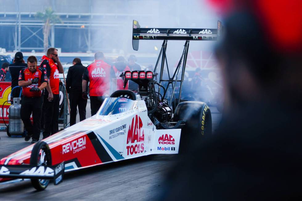 NHRA Top Fuel driver Doug Kalitta gets ready to race during the NHRA Top Fuel semifinals at the ...