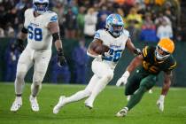 Detroit Lions running back Jahmyr Gibbs (26) runs against the Green Bay Packers during the seco ...