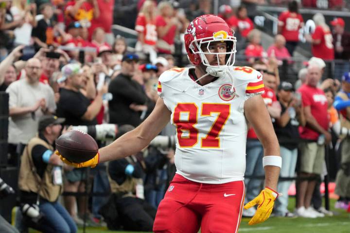 Kansas City Chiefs tight end Travis Kelce (87) warms up before an NFL football game against the ...