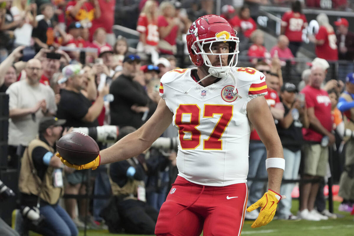 Kansas City Chiefs tight end Travis Kelce (87) warms up before an NFL football game against the ...