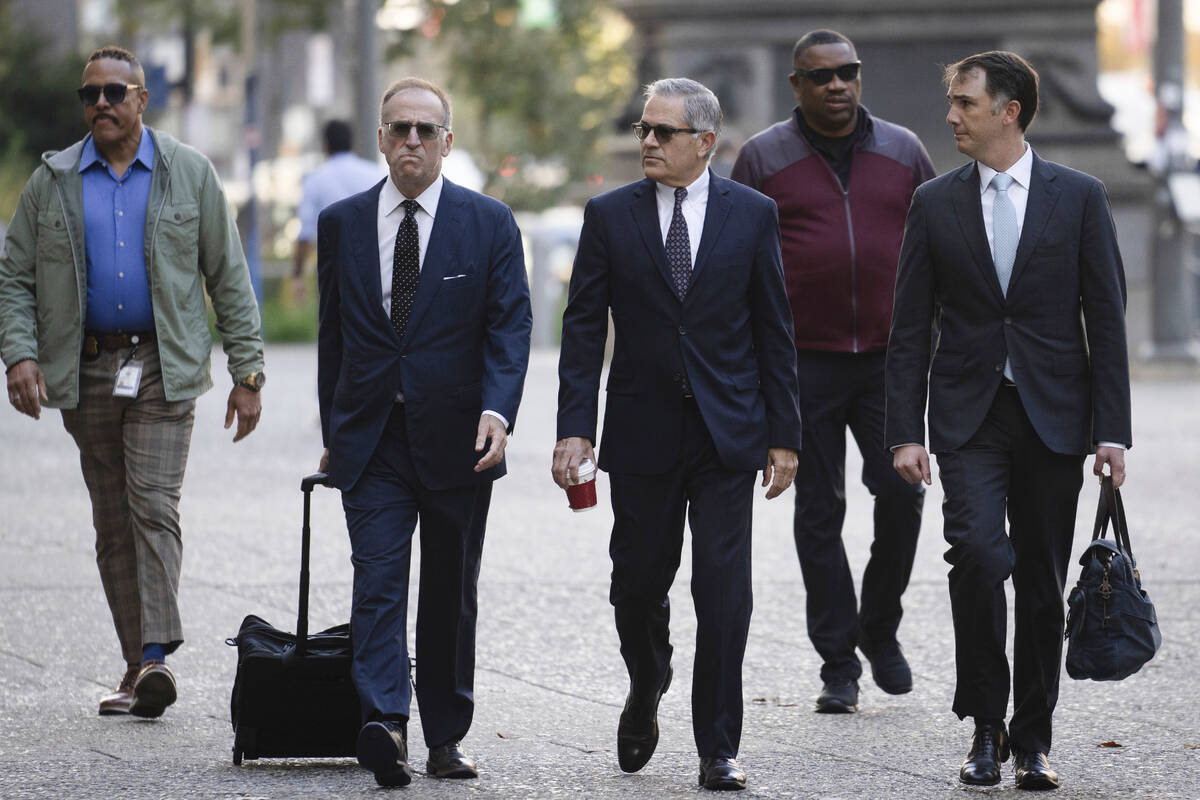 Philadelphia District Attorney Larry Krasner, third from right, arrives for a hearing at a Cit ...