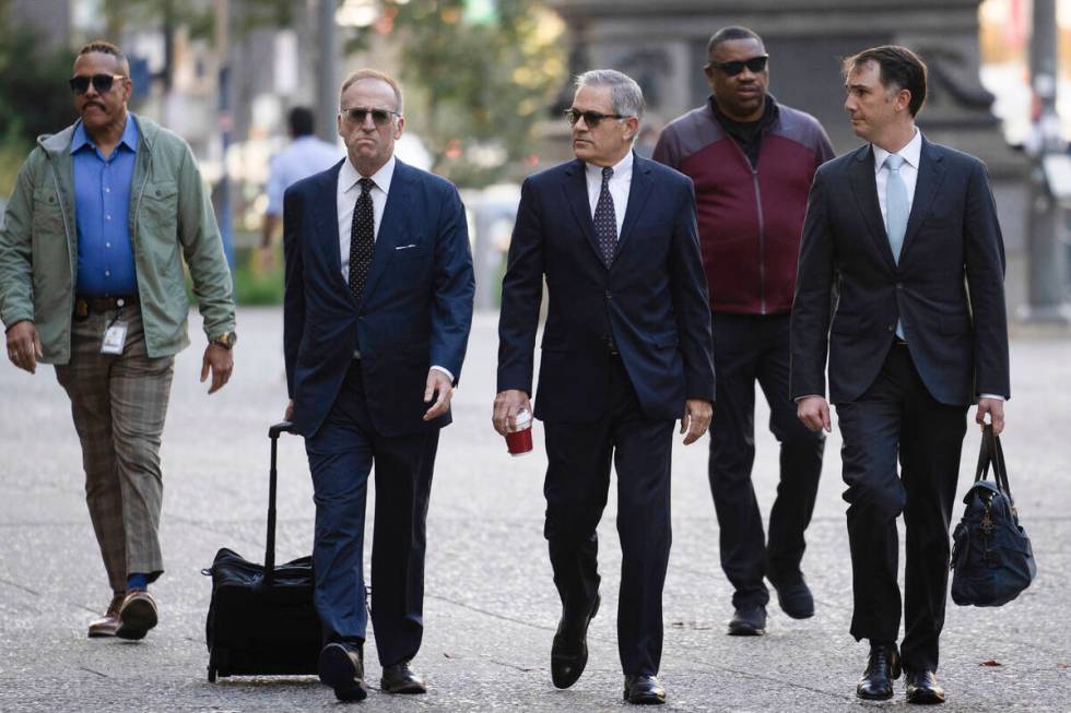 Philadelphia District Attorney Larry Krasner, third from right, arrives for a hearing at a Cit ...