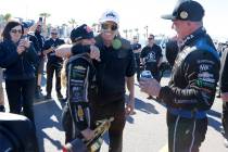 John Force hugs his daughter Top Fuel driver Brittany, left, after winning the NHRA Nationals a ...