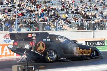 Funny car driver Blake Alexander takes off during the semifinals of the NHRA Nationals at the S ...