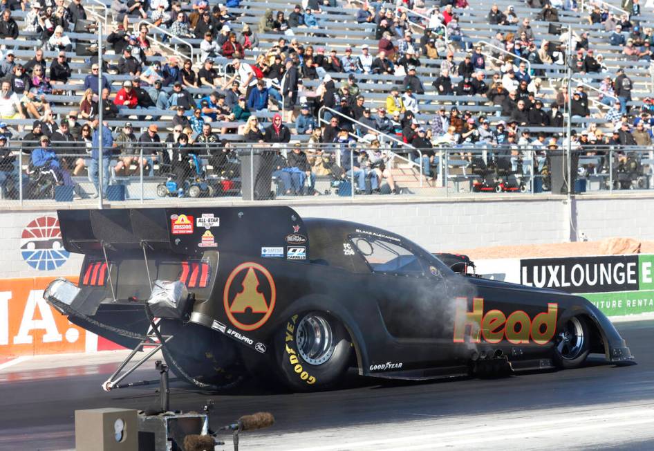 Funny car driver Blake Alexander takes off during the semifinals of the NHRA Nationals at the S ...