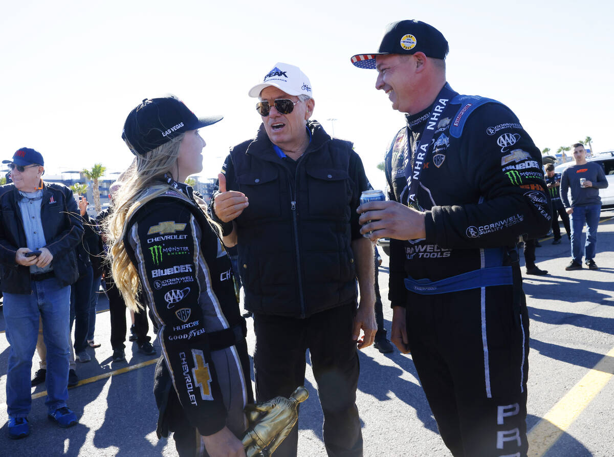 John Force talks to his daughter Top Fuel driver Brittany, left, after winning the NHRA Nationa ...