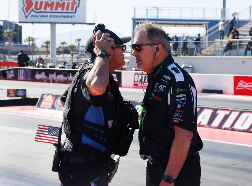 Ground crew discuss before the final race of the NHRA Nationals at the Strips at Las Vegas Spee ...