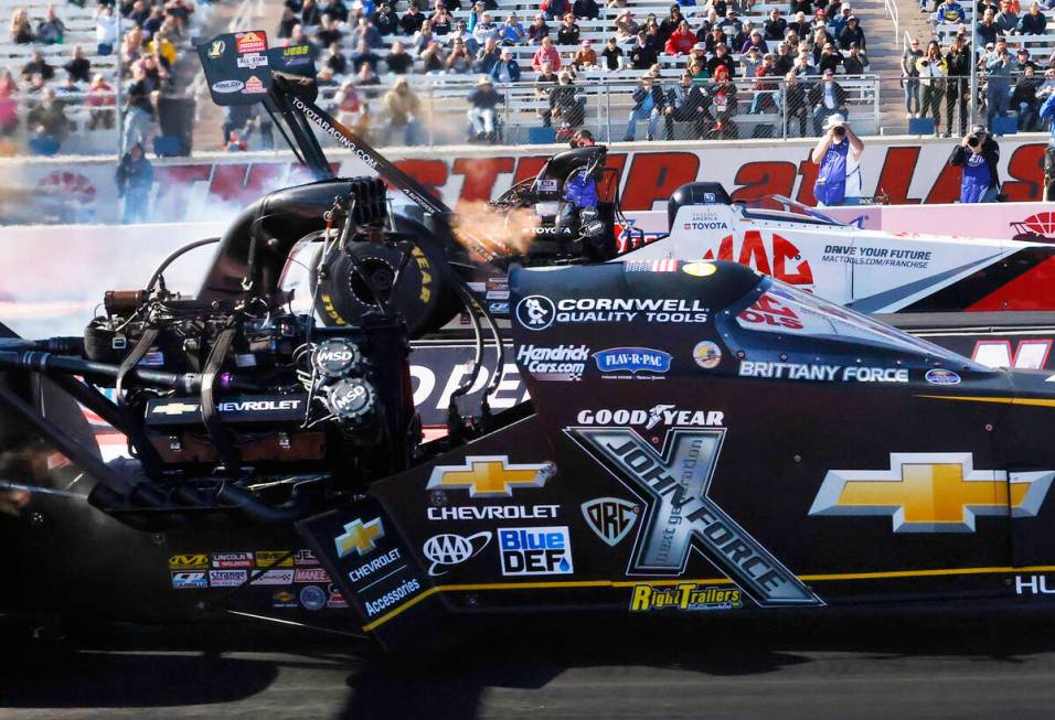 Top Fuel drivers Brittany Force, left, and Doug Kalitta take off during the final of the NHRA N ...