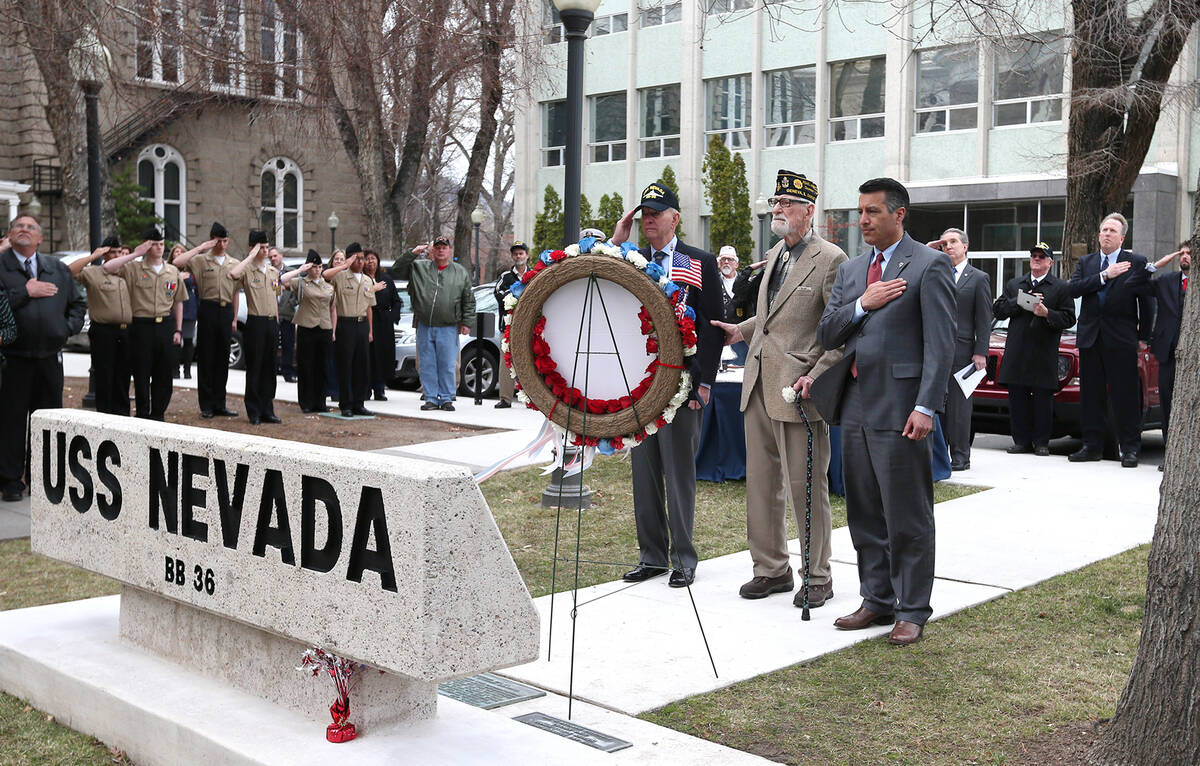 From left center, Bud Southard, president of the Navy League, veteran Charles Sehe and Gov. Bri ...