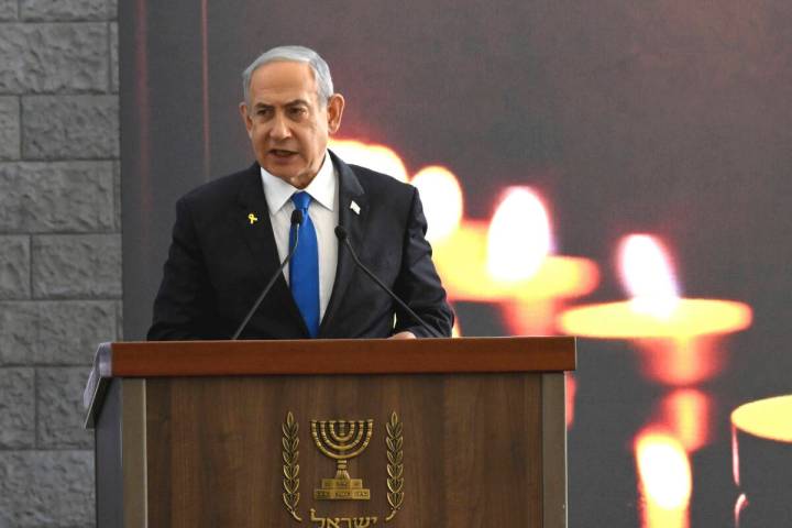 Israeli Prime Minister Benjamin Netanyahu speaks at a memorial ceremony for those killed by Ham ...